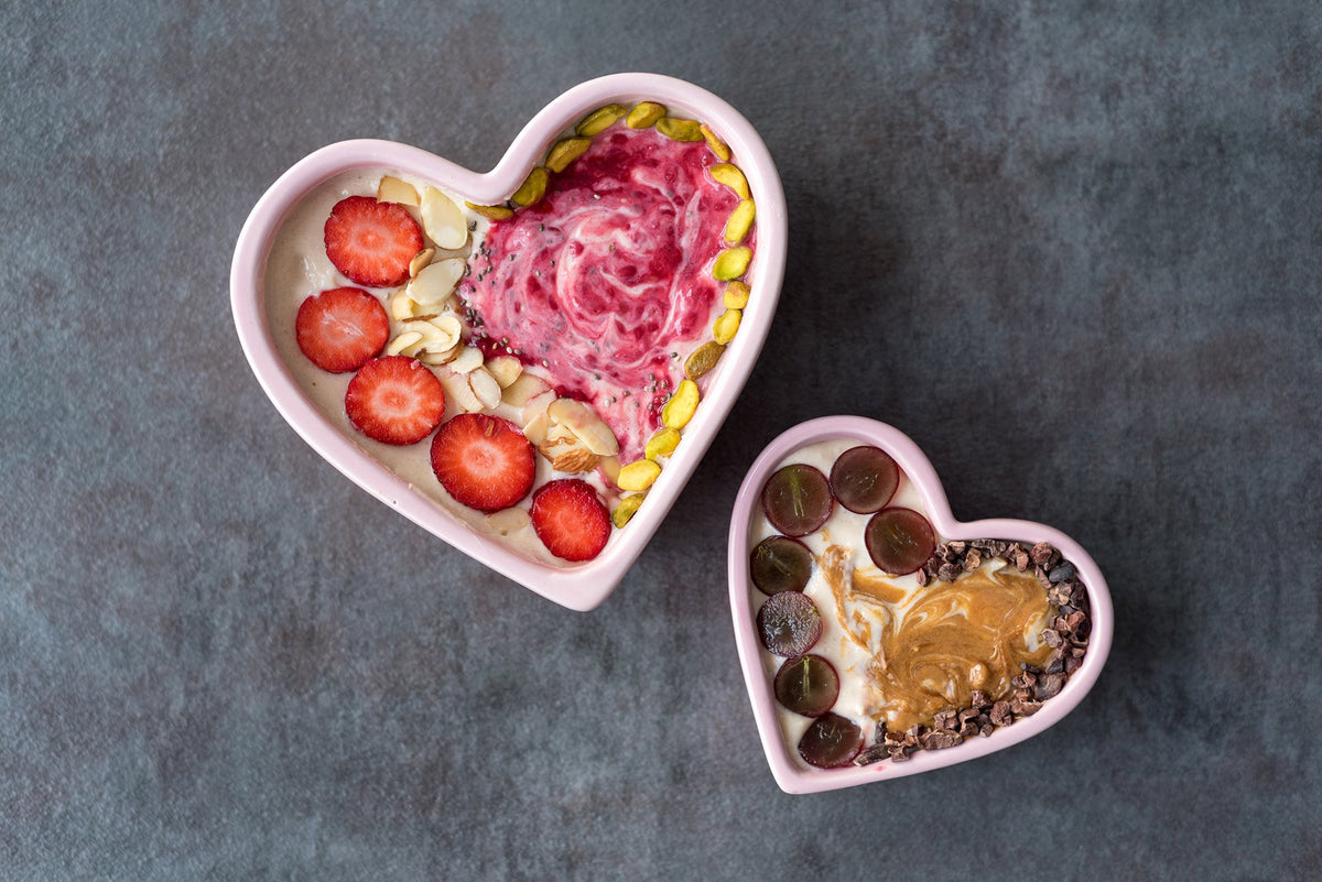 Two heart-shaped smoothie bowls