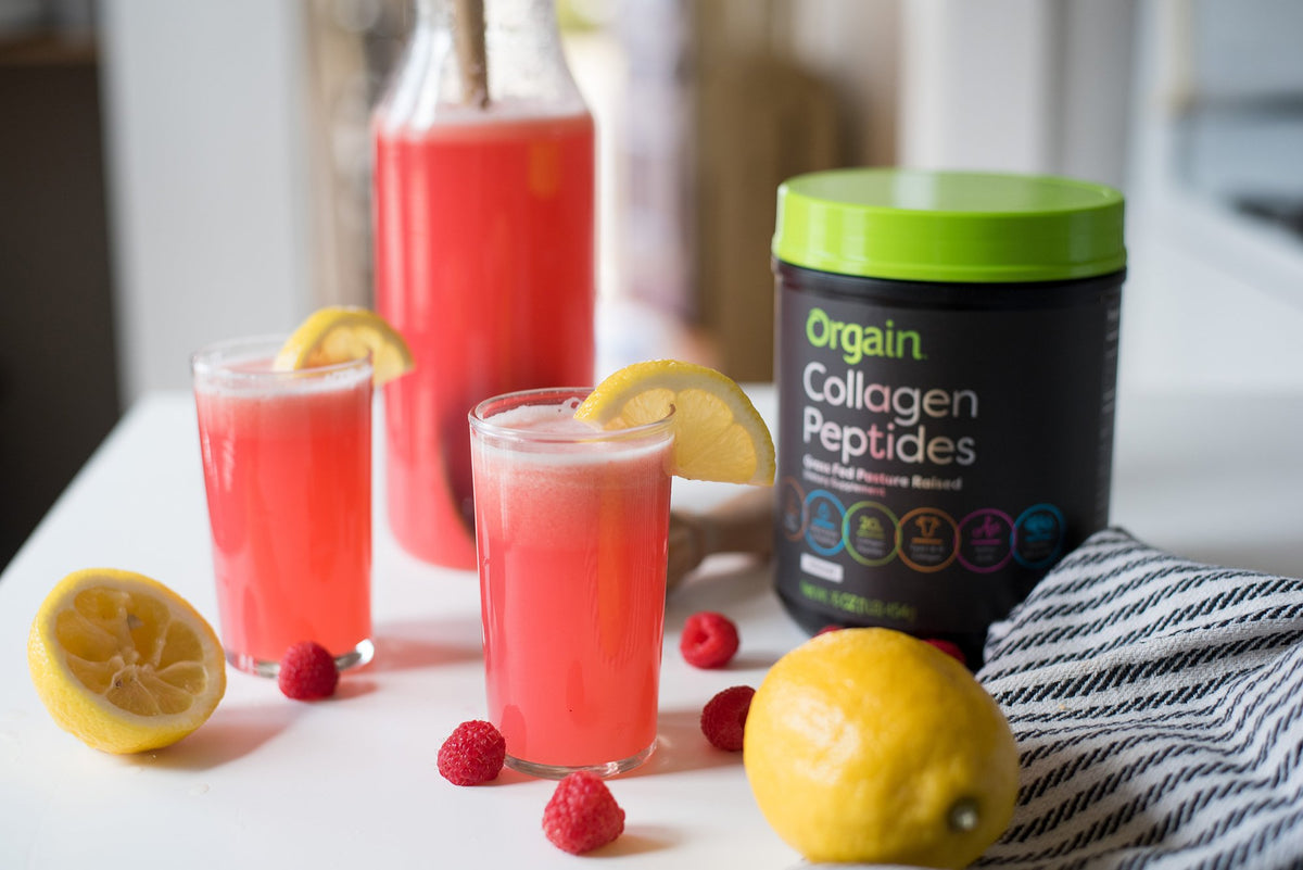 orgain collagen peptides next to two red beverages