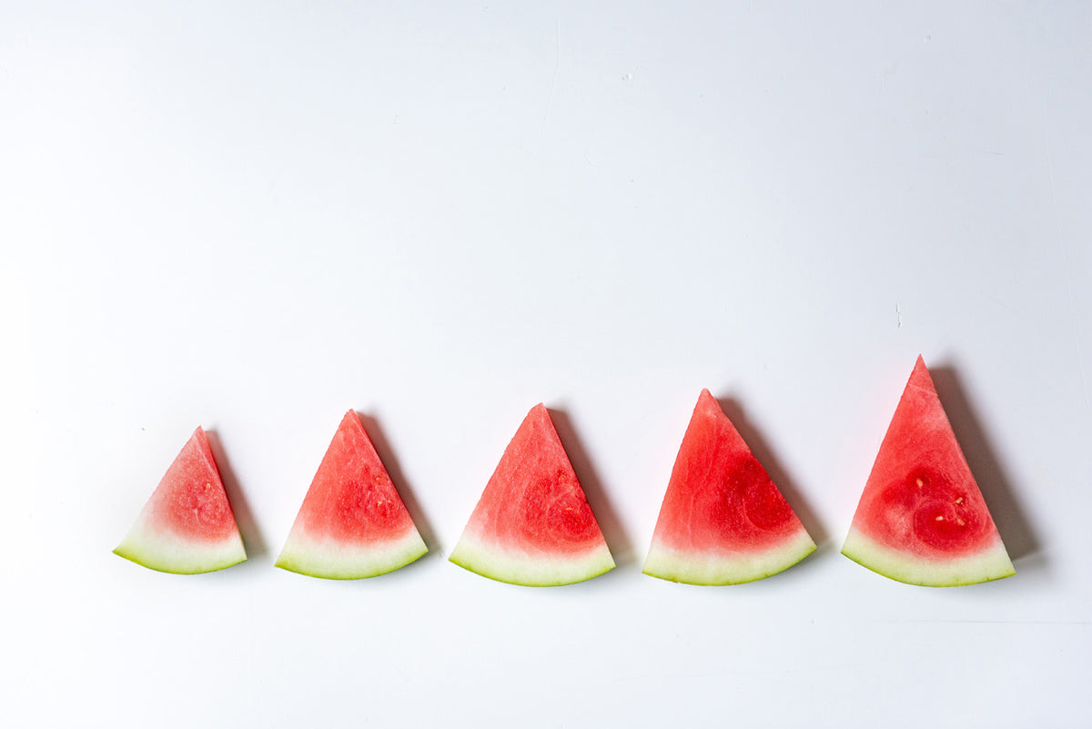 five slices of watermelon in a row